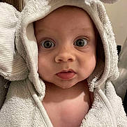 Henry is registered to the contest to win money with this photo: baby, towel, hooded_towel, face, eyes, skin, child, infant, cute, expression, texture, fabric, soft, person, portrait, indoor, closeup, head, wrapped, animal_ears