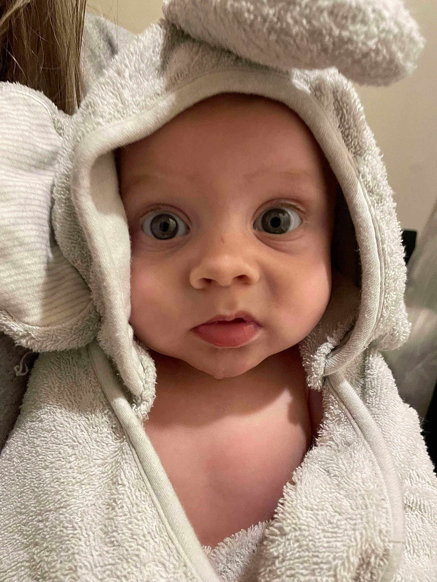 Henry is registered to the contest to win money with this photo: baby, towel, hooded_towel, face, eyes, skin, child, infant, cute, expression, texture, fabric, soft, person, portrait, indoor, closeup, head, wrapped, animal_ears