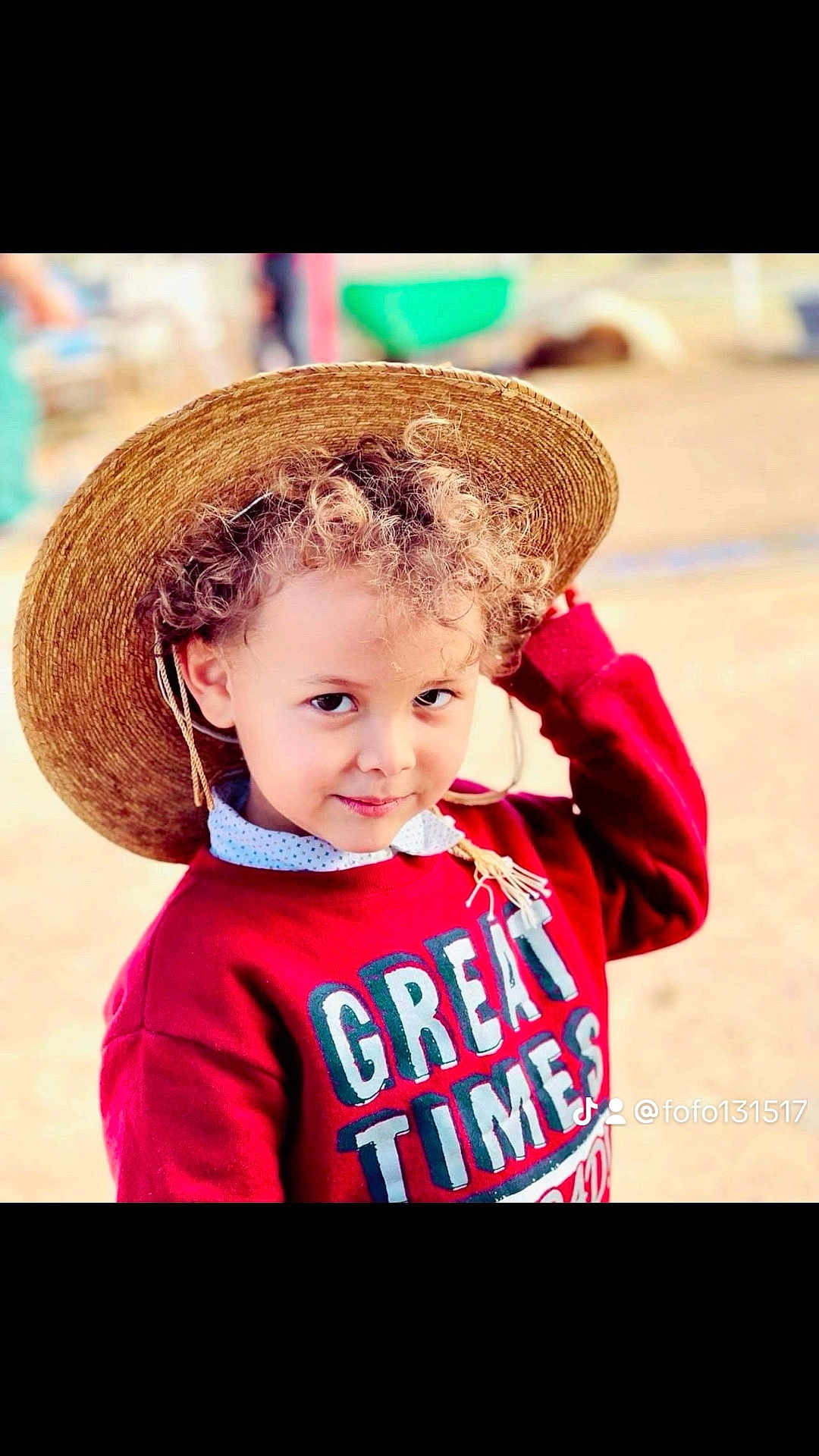 Rakan is registered to the contest to win money with this photo: child, curly_hair, straw_hat, red_sweater, outdoor, portrait, smiling, cute, young, playful, person, fashion, casual_wear, face, headwear, childhood, happy, daylight, fun, looking_at_camera