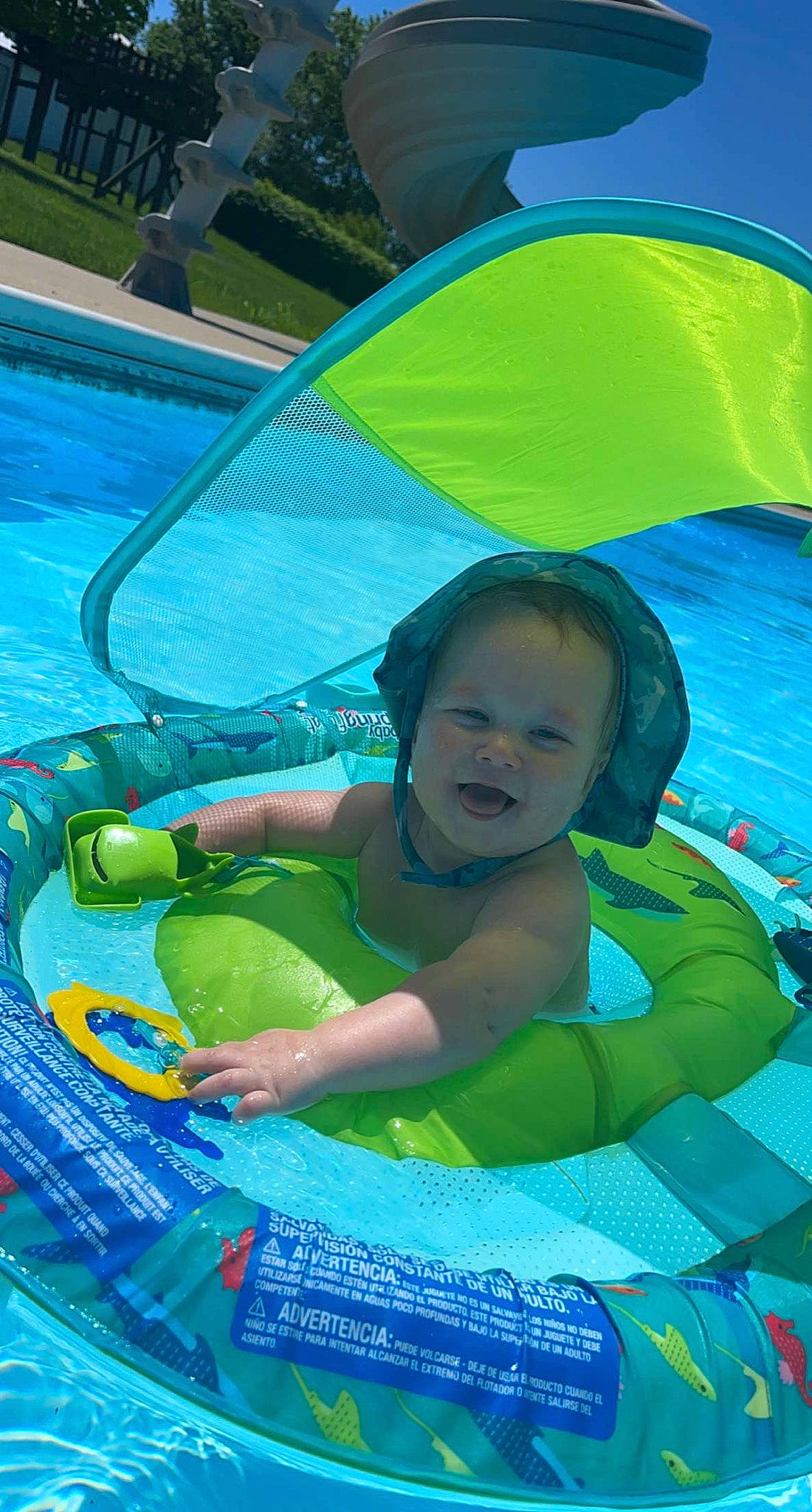 Memphis is registered to the contest to win money with this photo: aqua, azure, blue, child, fun, games, grass, green, happy, inflatable, leisure, people_in_nature, person, personal_protective_equipment, recreation, shade, summer, swimming_pool, toddler, vacation