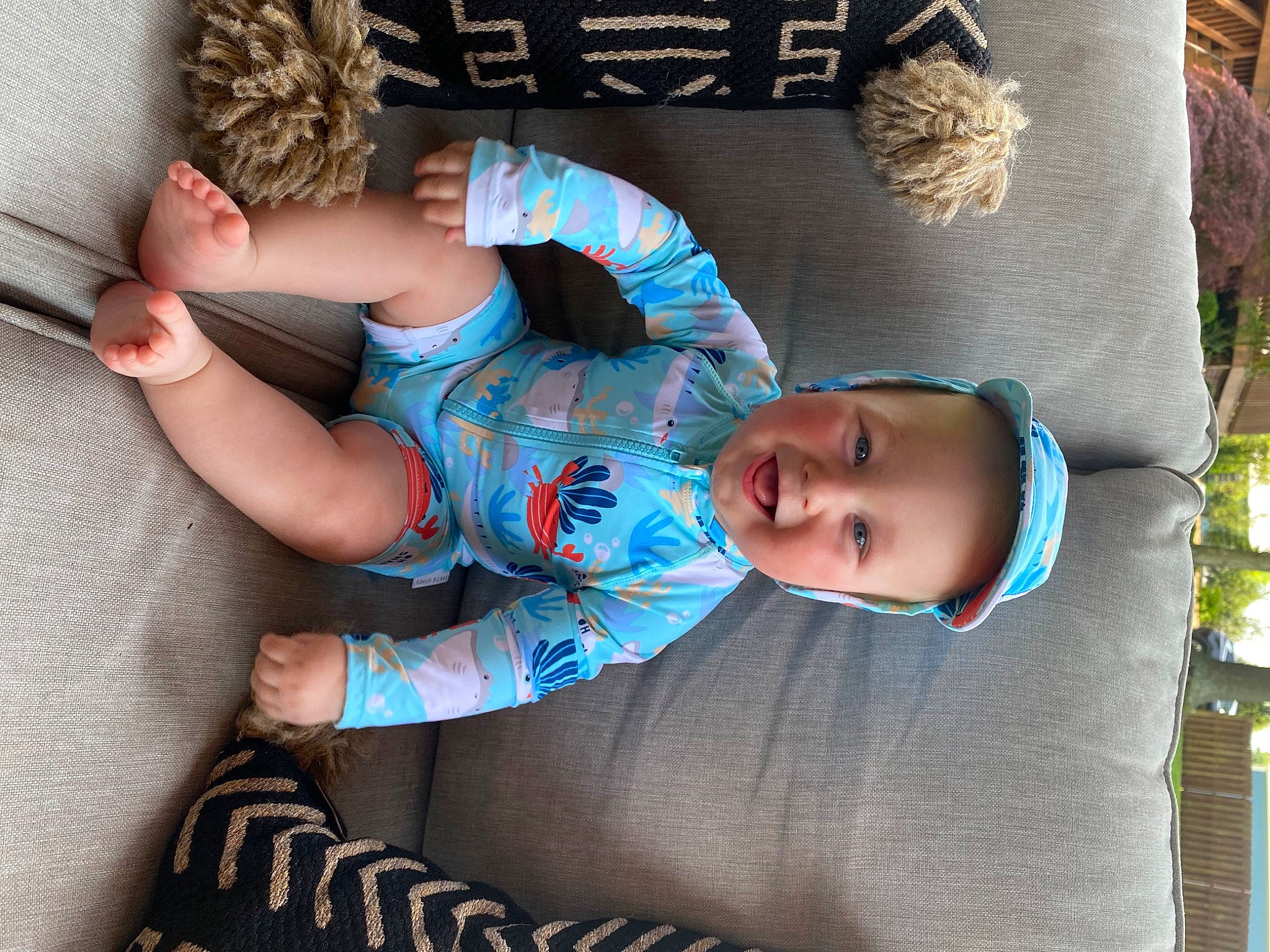 Memphis is registered to the contest to win money with this photo: azure, baby, baby_toddler_clothing, blue, comfort, cool, couch, facial_expression, finger, hairstyle, hand, head, headgear, human_body, leg, person, skin, sleeve, textile, toddler