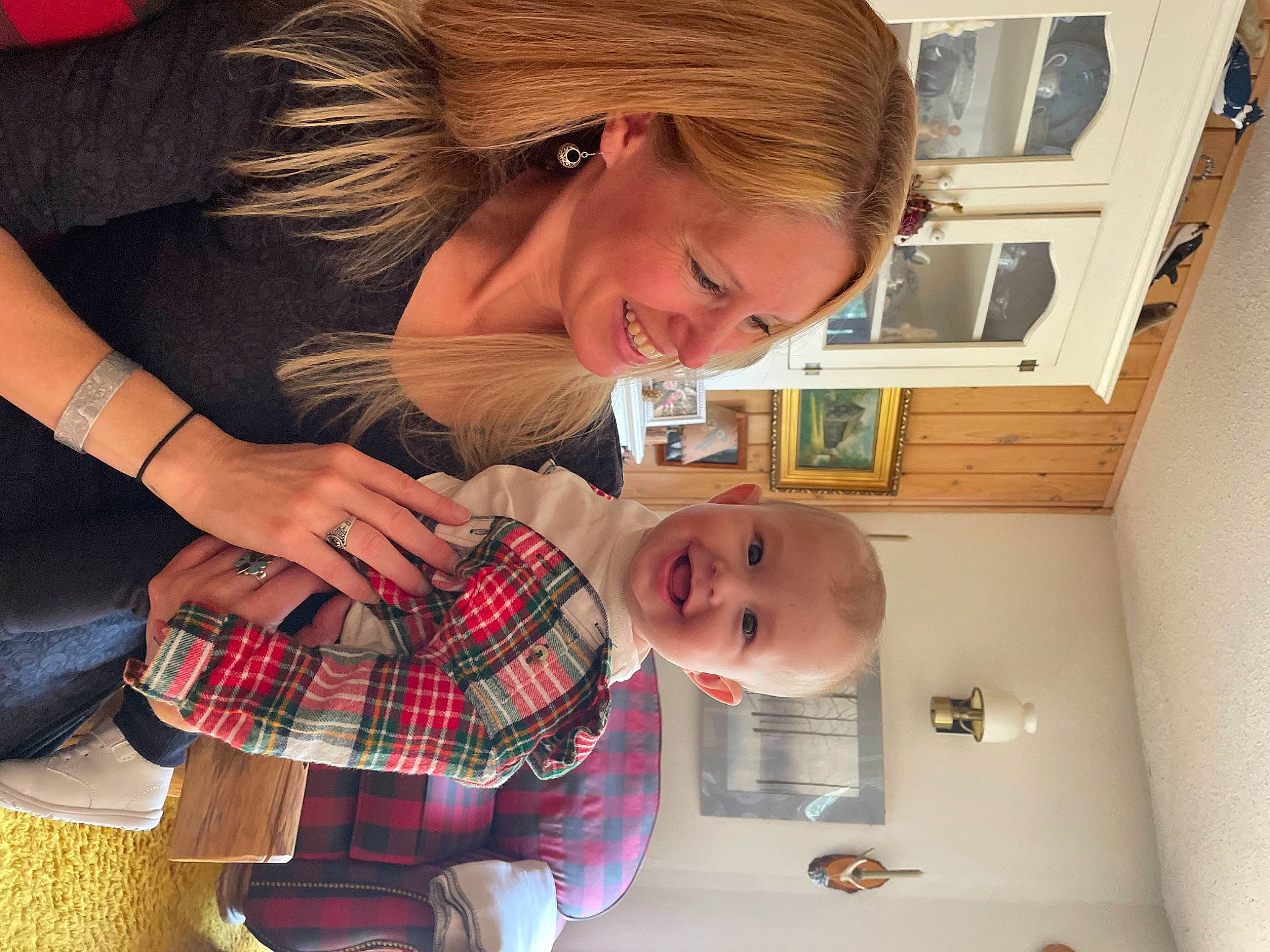 Holden is registered to the contest to win money with this photo: bangs, child, eye, eyelash, eyewear, face, fun, hair_coloring, hairstyle, happy, joy, mouth, pattern, person, plaid, room, sitting, smile, t_shirt, tartan