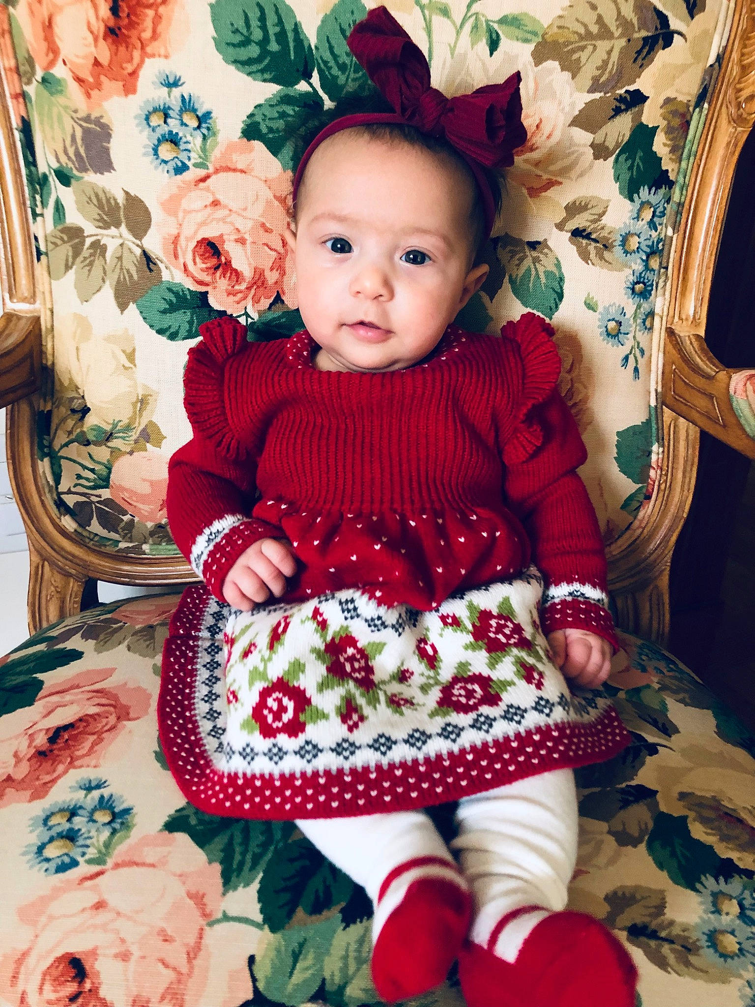 Selena is registered to the contest to win money with this photo: baby, baby_toddler_clothing, chair, child, dress, eye, face, head, headgear, magenta, outerwear, pattern, person, pink, purple, skin, sleeve, textile, toddler, white