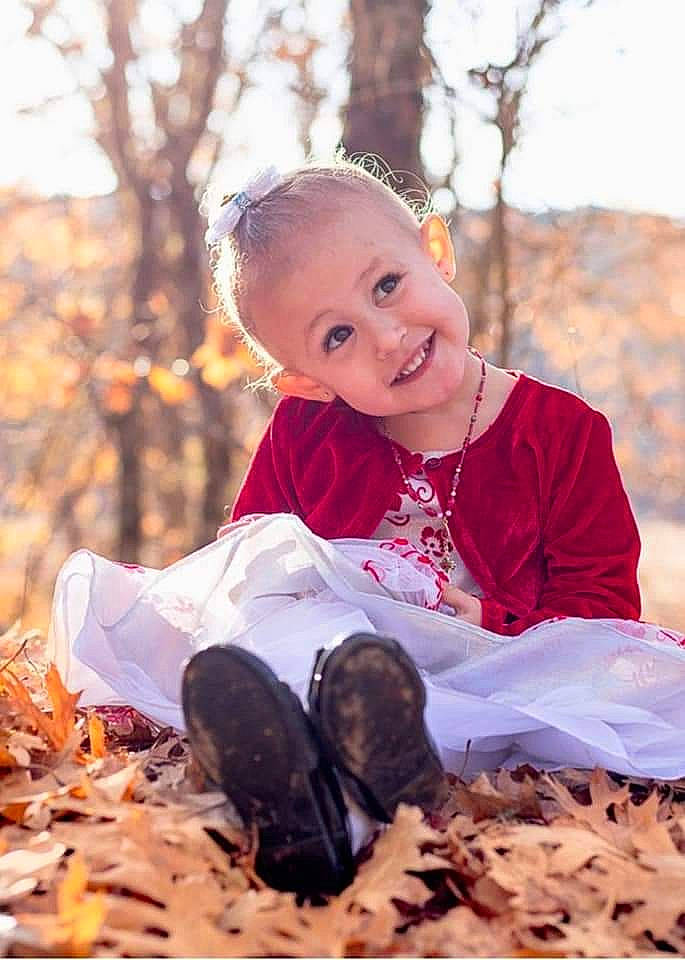Helena is registered to the contest to win money with this photo: baby, baby_toddler_clothing, child, deciduous, dress, face, flash_photography, forest, grass, happy, human_body, joy, leaf, people_in_nature, person, plant, smile, sunlight, t_shirt, toddler