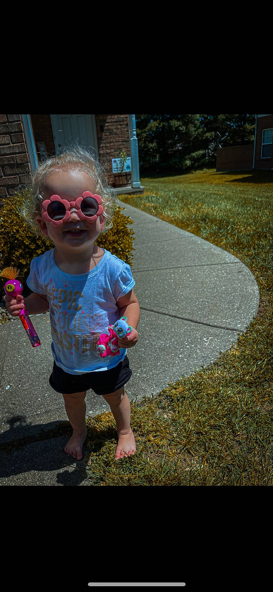 Austen joined the competition — help win amazing prizes! asphalt, baby_toddler_clothing, child, cool, eyewear, glasses, goggles, grass, happy, leaf, leisure, people_in_nature, person, pink, plant, public_space, road_surface, smile, sunglasses, toddler