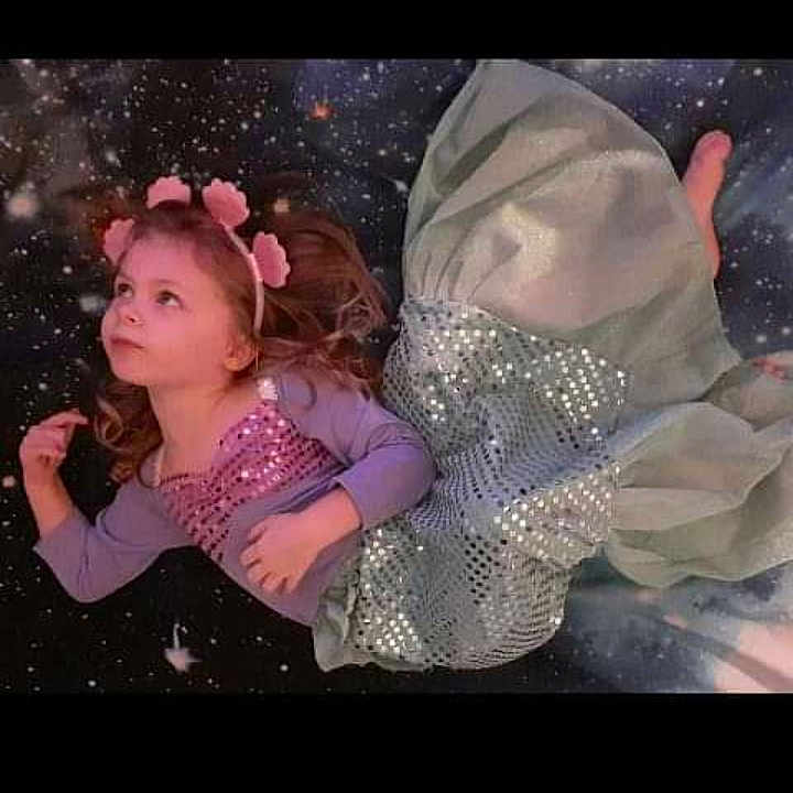 Luna Rae is registered to the contest to win money with this photo: art, bridal_accessory, child, darkness, embellishment, entertainment, event, eyelash, fashion_accessory, flash_photography, gesture, hair_accessory, hand, happy, headpiece, jewellery, magenta, petal, pink, visual_arts