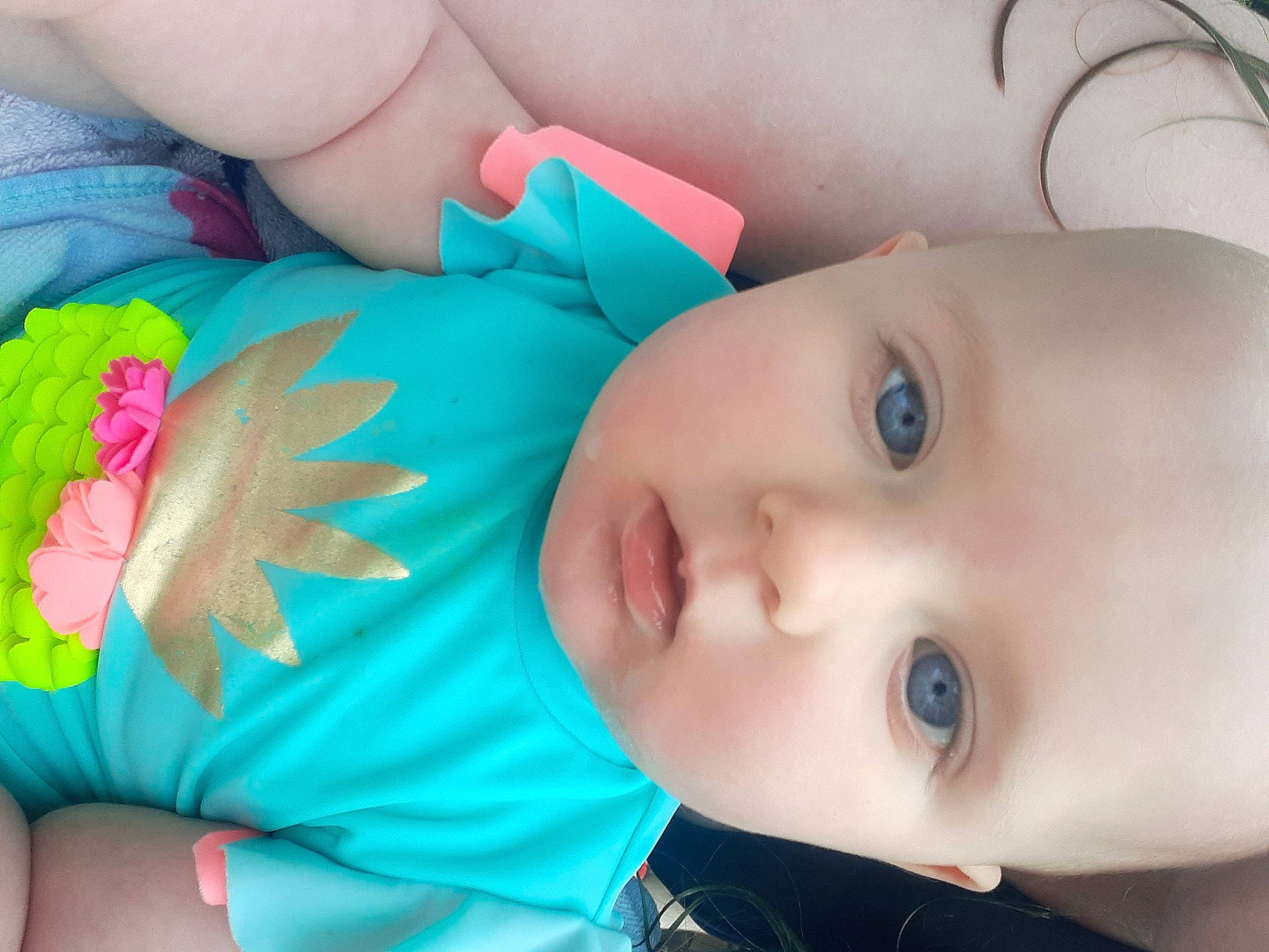 Scarlett joined the competition — help win amazing prizes! baby, baby_toddler_clothing, cheek, child, electric_blue, eyelash, facial_expression, gesture, grass, happy, human_body, iris, lip, mouth, nose, person, plant, product, skin, toddler