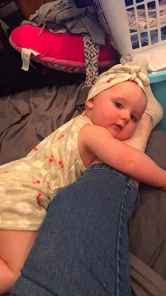 Scarlett is registered to the contest to win money with this photo: baby, baby_toddler_clothing, cap, cheek, child, comfort, fun, happy, headwear, human_leg, magenta, mouth, pattern, person, pink, red, sitting, skin, smile, t_shirt