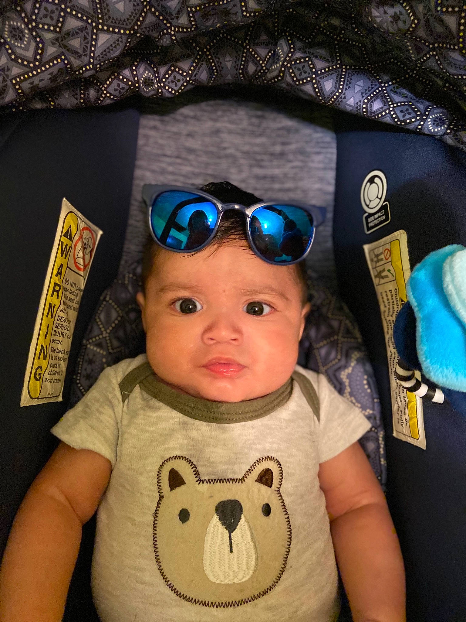 Emilio is registered to the contest to win money with this photo: baby, baby_toddler_clothing, blue, cap, cheek, chin, eyebrow, eyewear, facial_expression, glasses, happy, head, headwear, mammal, mouth, nose, person, skin, sleeve, textile