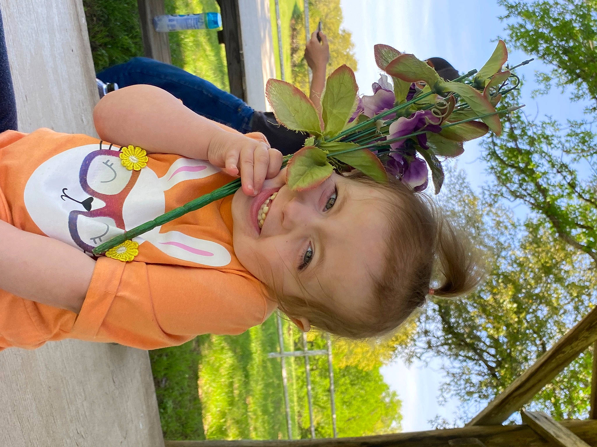 Chevelle is registered to the contest to win money with this photo: arm, child, eye, fun, grass, happy, head, human_body, human_leg, leisure, people_in_nature, person, plant, recreation, skin, sky, terrestrial_plant, toddler, tree, twig