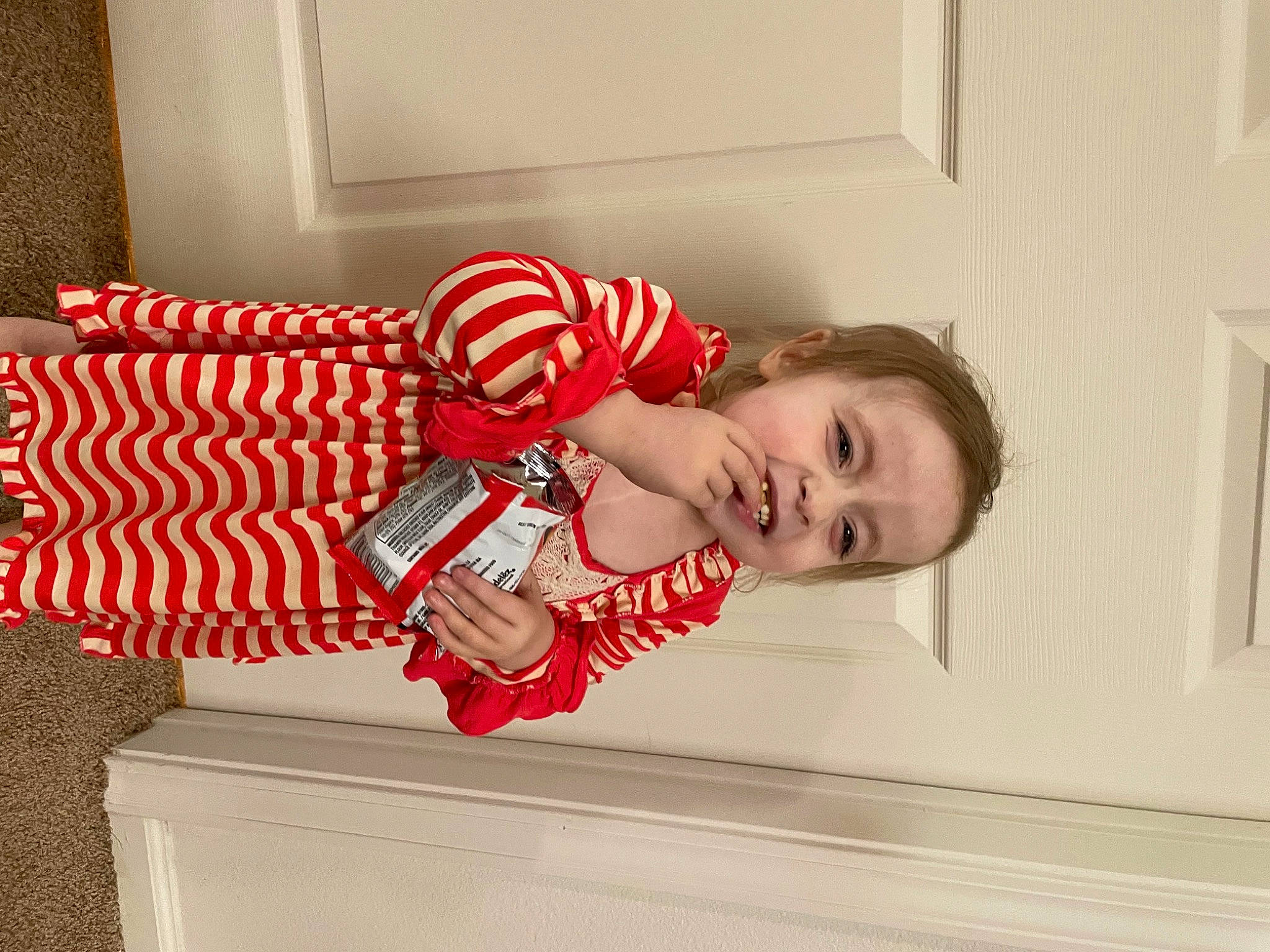 Chevelle is registered to the contest to win money with this photo: baby, baby_toddler_clothing, carmine, child, christmas, comfort, event, happy, holiday, human_leg, knee, pattern, person, plaid, room, sitting, thigh, toddler, window, window_blind