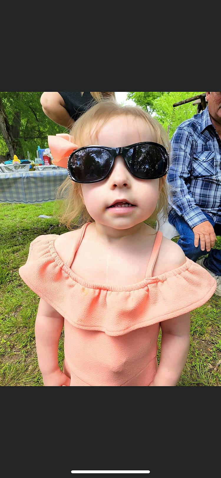 Chevelle is registered to the contest to win money with this photo: botany, cap, cool, eyewear, fun, glasses, goggles, grass, happy, leisure, lip, person, pink, plant, recreation, summer, sun_hat, sunglasses, toddler, tree