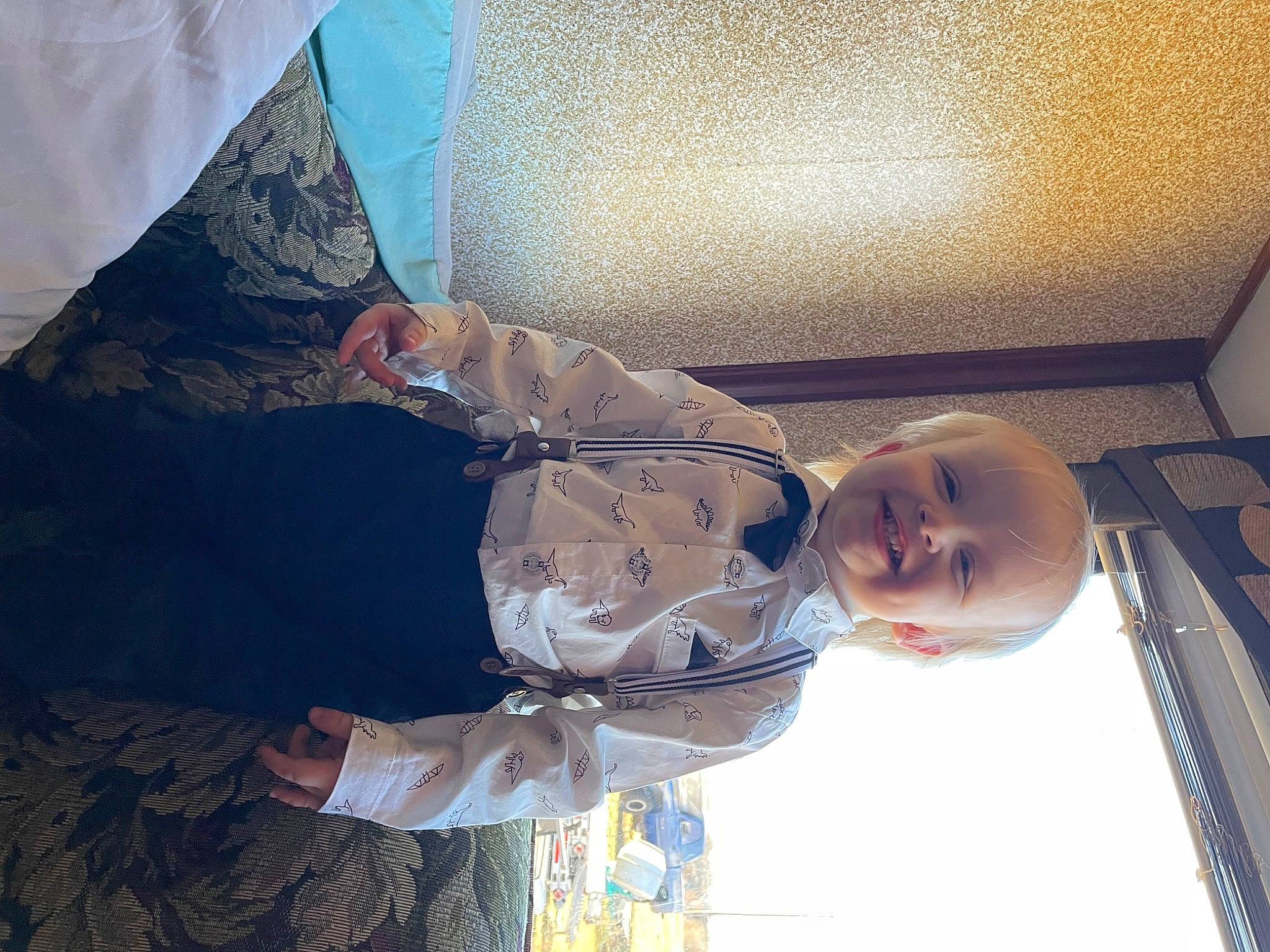Colt is registered to the contest to win money with this photo: baby, baby_products, baby_toddler_clothing, child, cloud, comfort, elbow, fun, happy, joy, linens, pattern, person, room, shade, sitting, sky, textile, tints_and_shades, toddler