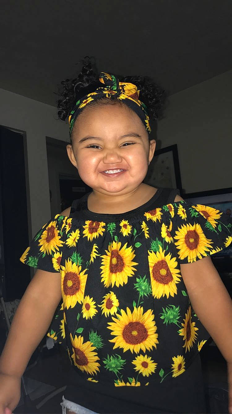 Nevaeh joined the competition — help win amazing prizes! child, fashion_accessory, flower, hair_accessory, headband, headpiece, joy, lei, person, plant, smile, sunflower, toddler