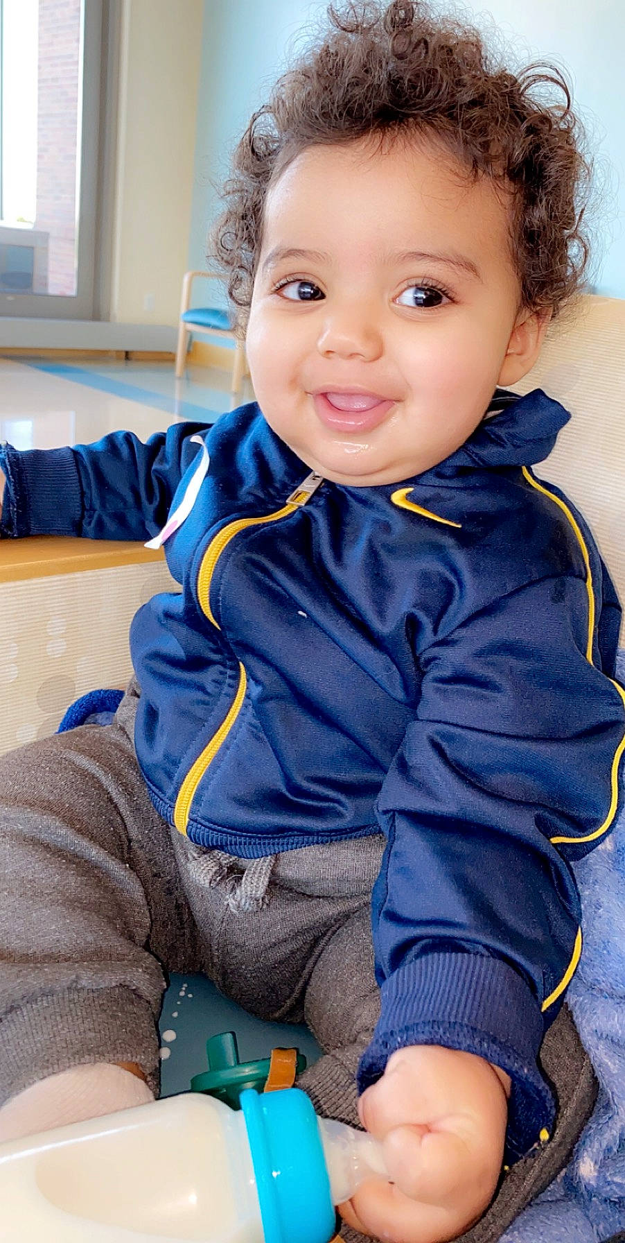 Shamaan Jr is registered to the contest to win money with this photo: baby, baby_toddler_clothing, blue, cheek, child, child_model, face, head, jacket, joy, outerwear, person, play, sitting, skin, sleeve, smile, standing, toddler