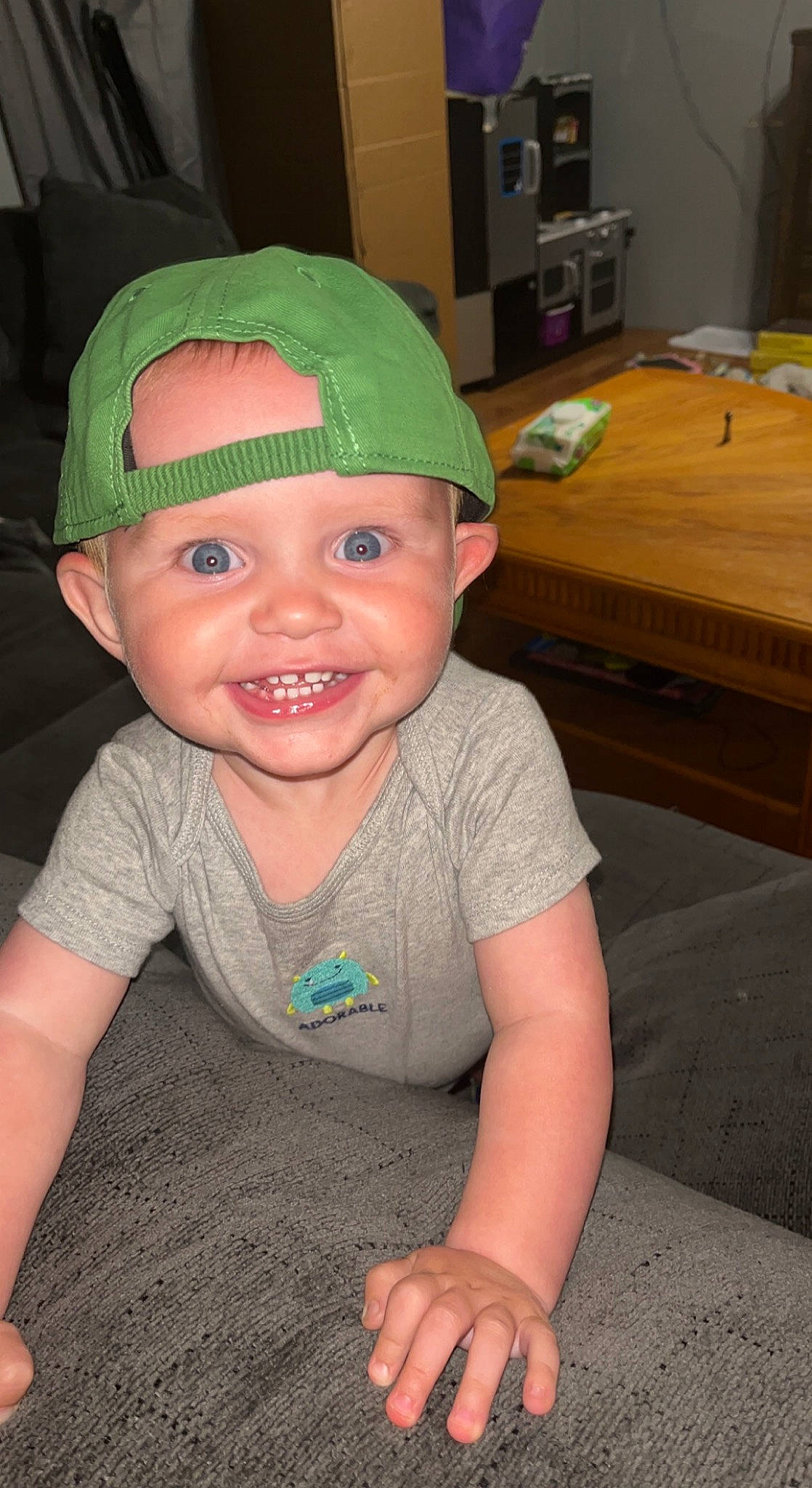 Gunnar is registered to the contest to win money with this photo: baby_toddler_clothing, baseball_cap, cap, cheek, chin, costume_hat, eye, fun, happy, head, headwear, human_body, iris, joy, lip, mouth, nose, person, skin, sleeve
