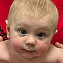baby, child, face, skin, hands, red_background, closeup, curious, infant, young, portrait, person, eyebrows, cheeks, eyes, fingers, human, head, expression, cute