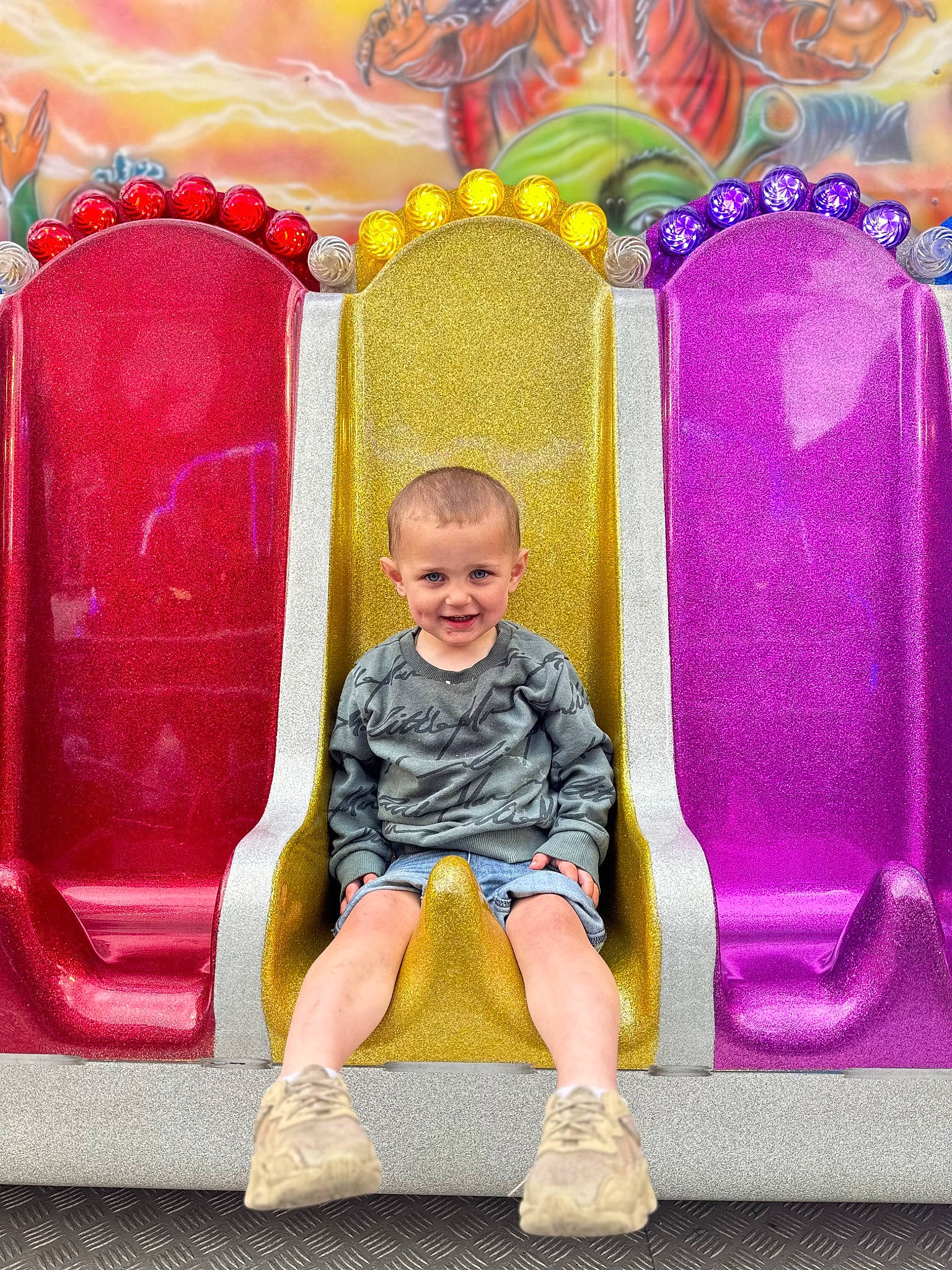Kenston joined the competition — help win amazing prizes! art, baby, chair, child, classic, comfort, fashion, fun, happy, joy, leisure, magenta, outdoor_play_equipment, person, pink, purple, room, shorts, sitting, smile