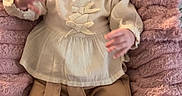 Arya participe au concours pour gagner de l'argent avec cette photo : baby, bed, blanket, blouse, cheeks, child, cozy, face, gaze, hands, infant, lying_down, outfit, pants, pink, plush, portrait, shoes, slippers, soft_texture