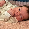 Arya participe au concours pour gagner de l'argent avec cette photo : adorable, baby, bedding, blanket, close_up, cozy, eye, fabric, face, fist, hair, hand, home, infant, lying_down, newborn, onesie, pink_blanket, portrait, skin