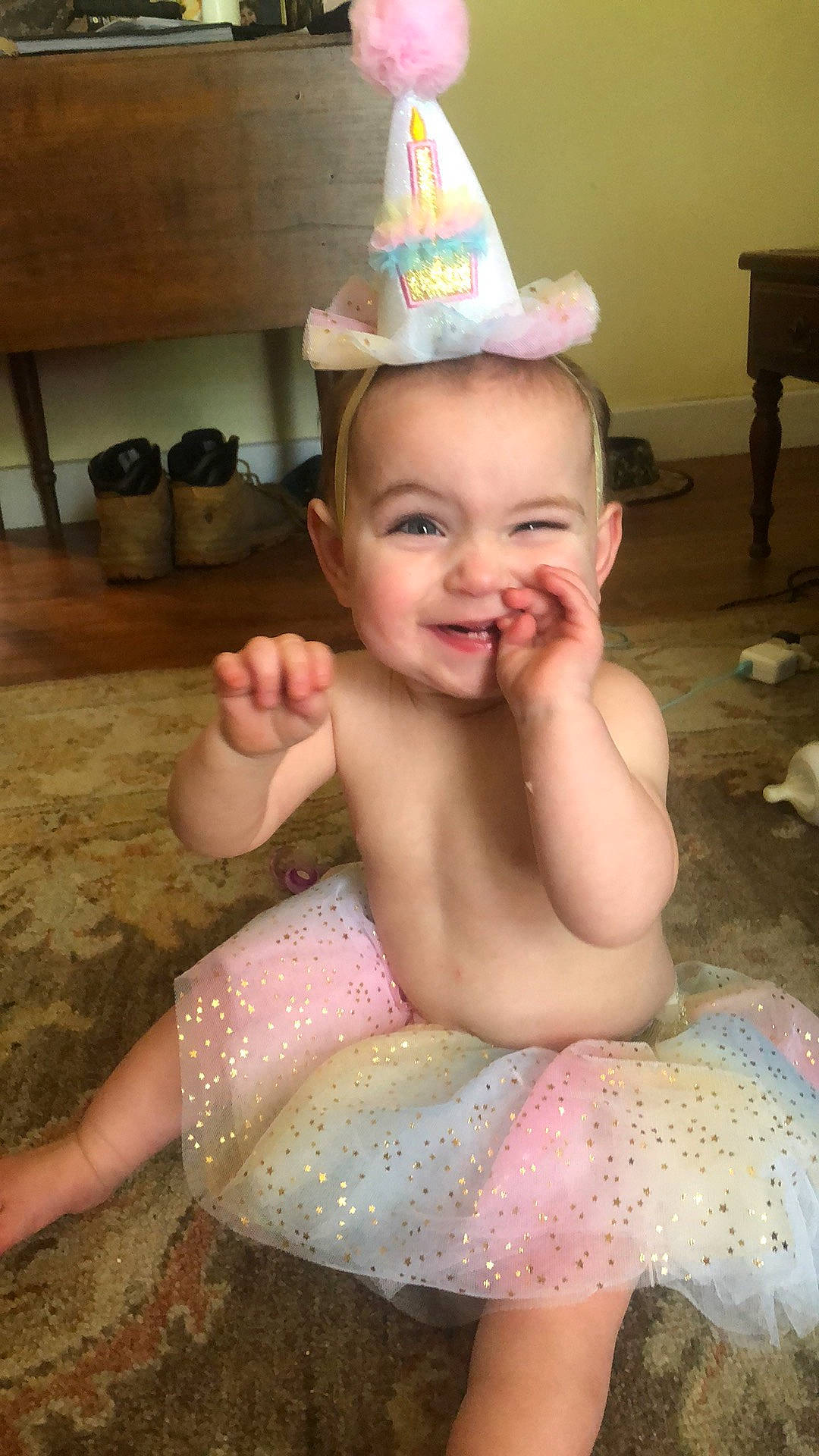 Willow is registered to the contest to win money with this photo: baby, bathing, cap, cheek, chest, cone, costume_hat, face, finger, fun, happy, head, human_body, joy, mouth, party_hat, person, pink, skin, smile