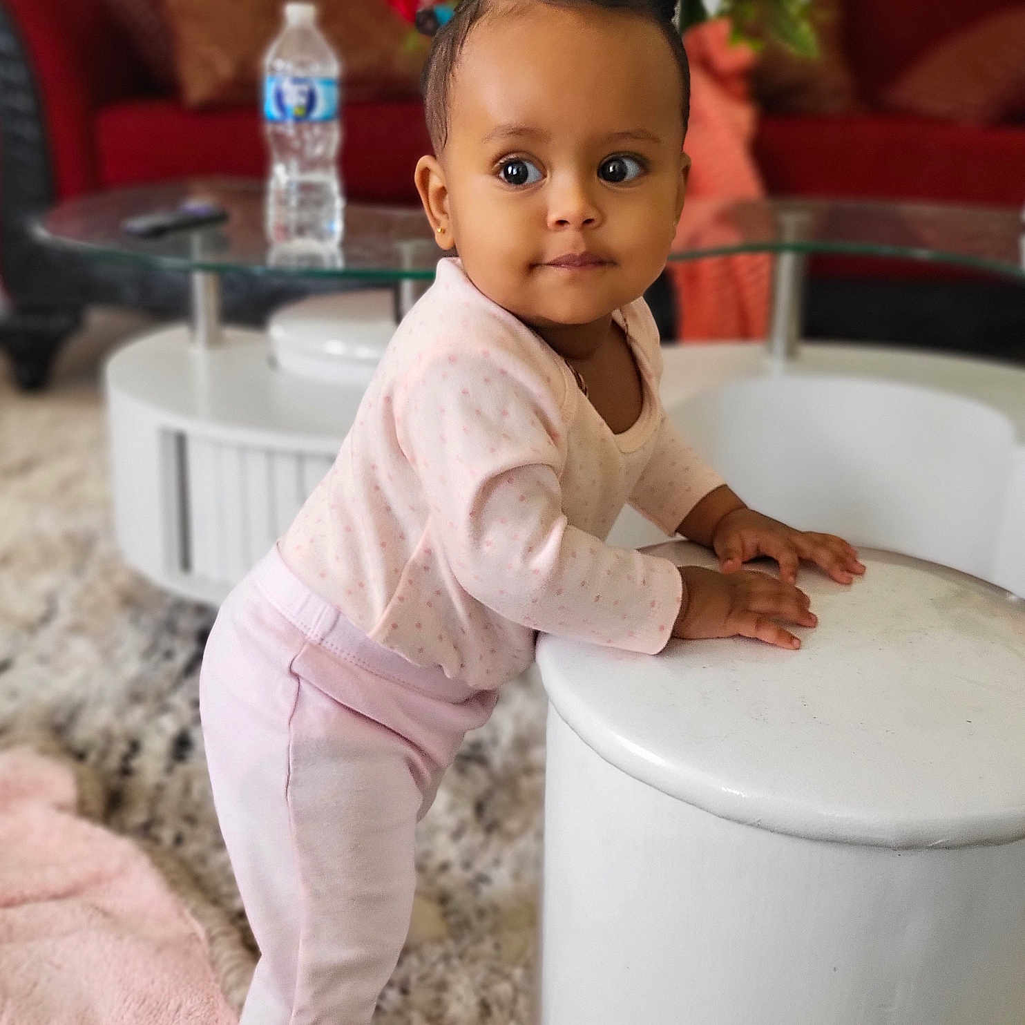 Naomi is registered to the contest to win money with this photo: baby, bodypart, clothing, face, finger, flower, flowerarrangement, flowerbouquet, furniture, hand, head, indoors, person, photography, plant, portrait, pottedplant, sitting, sleeve, standing