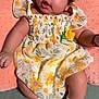 Madison joined the competition — help win amazing prizes! baby, infant, child, dress, floral_pattern, pink_cushion, socks, cute, portrait, indoors, smiling, curly_hair, skin, hand, foot, laying_down, fabric, soft_texture, happy, adorable