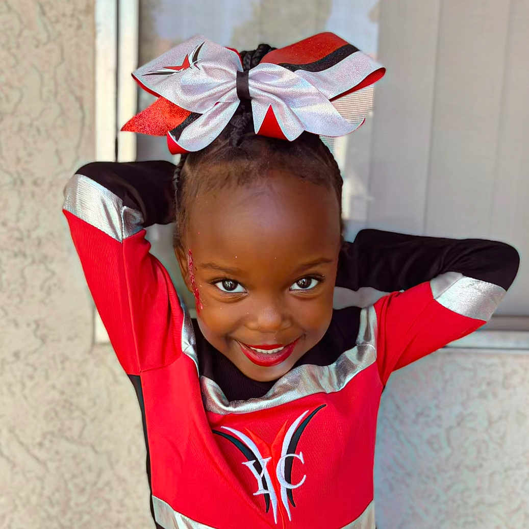Saniyya joined the competition — help win amazing prizes! ball, child, clothing, costume, face, female, football, girl, happy, head, person, photography, portrait, shirt, sleeve, smile, soccer, soccerball, sport, t_shirt