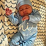 Alegend joined the competition — help win amazing prizes! baby, newborn, sleeping, blue_clothing, hat, blanket, soft_texture, cozy, infant, cute, peaceful, child, pajamas, lying_down, indoors, small_hands, small_feet, white_socks, patterned_blanket, portrait