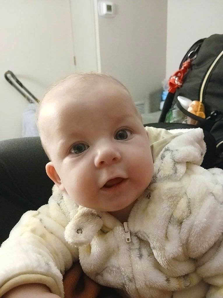 Judy Heavenly-Grace is registered to the contest to win money with this photo: baby, child, face, eyes, jacket, fur_clothing, indoor, curious, soft_texture, closeup, person, infant, cute, warm_clothing, expression, head, portrait, young, furniture, home