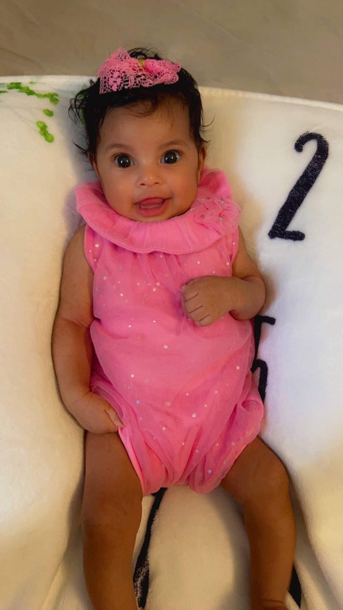 Amira joined the competition — help win amazing prizes! baby_toddler_clothing, cheek, dress, eyelash, finger, happy, head, human_body, joint, knee, lip, neck, person, pink, shoulder, skin, sleeve, smile, standing, thigh