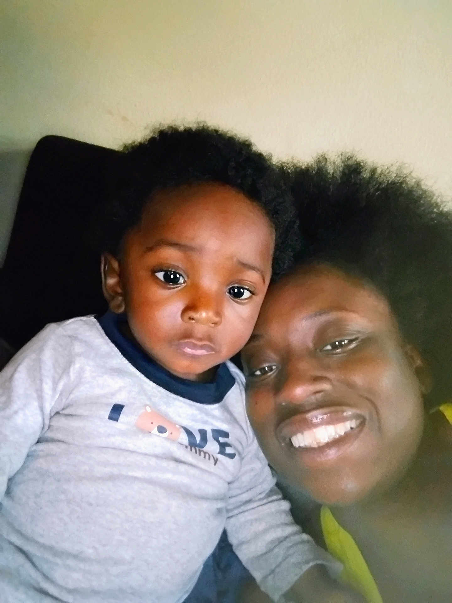 Quentin is registered to the contest to win money with this photo: child, toddler, adult, smile, face, indoor, portrait, hair, clothing, love, expression, closeup, person, happy, candid, casual, family, skin, head, sitting