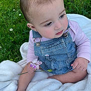 Tiana joined the competition — help win amazing prizes! baby, child, flower, grass, blanket, overalls, pink_shirt, outdoor, nature, sitting, cute, infant, greenery, clover, soft_texture, portrait, skin, head, face, hand