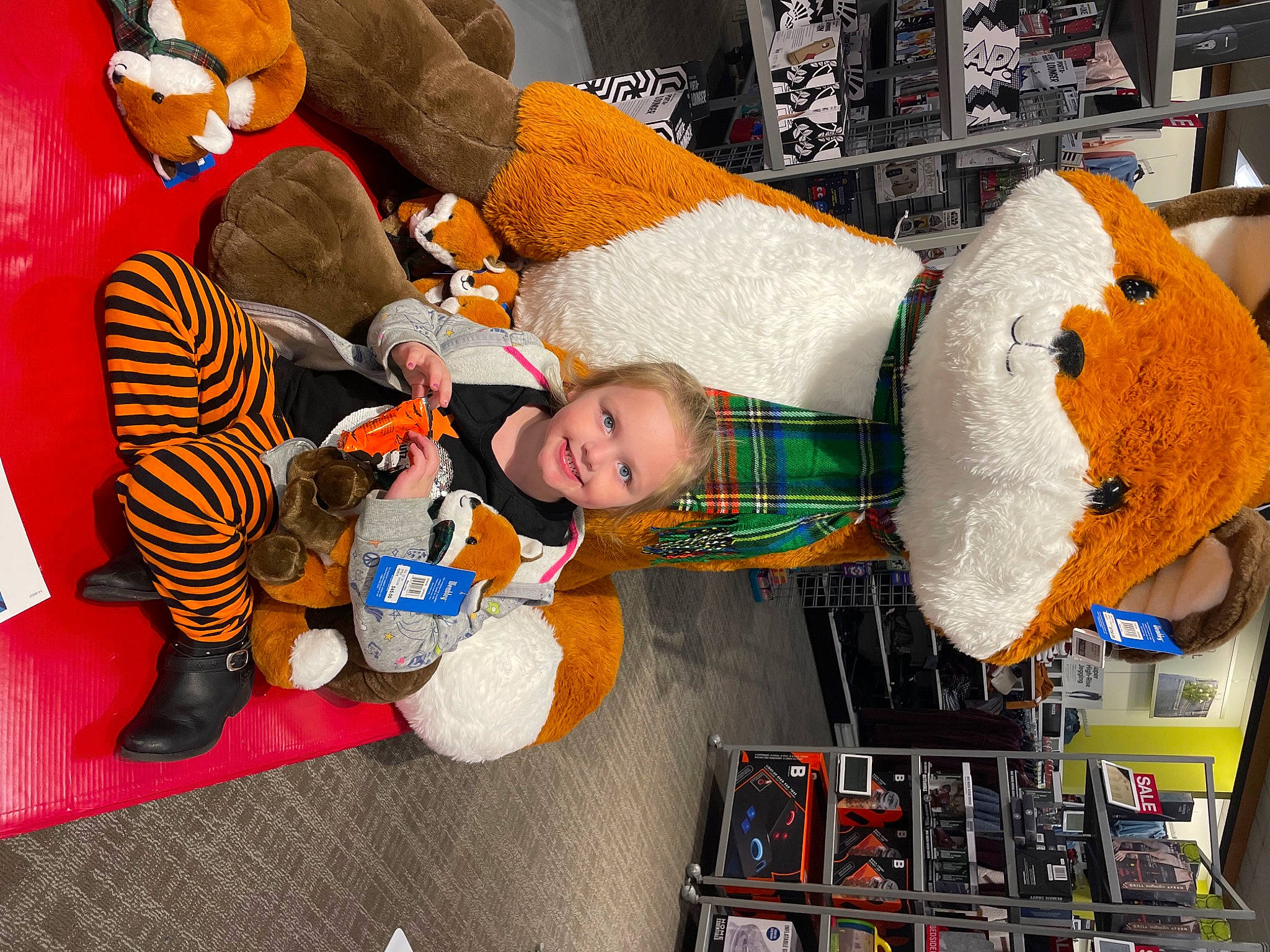 Brooke joined the competition — help win amazing prizes! baby, baby_toys, child, comfort, couch, fictional_character, fun, hat, holiday, joy, linens, orange, people, person, play, plush, product, room, smile, stuffed_toy