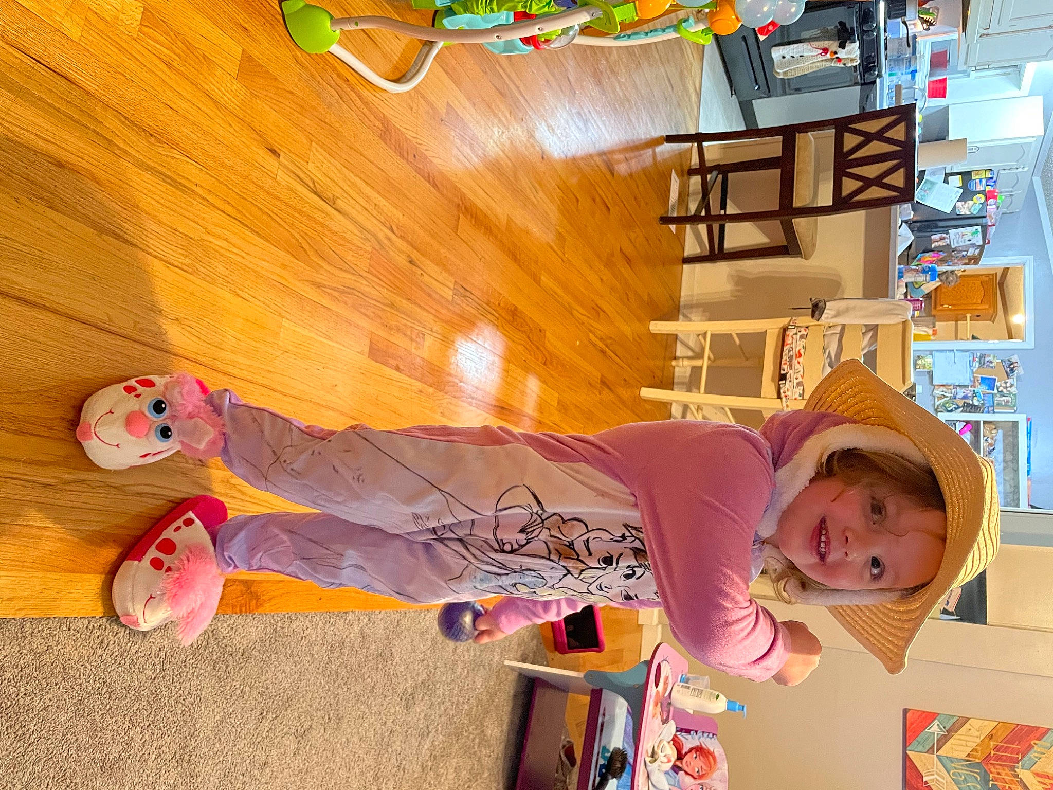 Brooke is registered to the contest to win money with this photo: baby, child, floor, flooring, font, fun, happy, hardwood, hat, joy, leisure, orange, person, play, plywood, room, t_shirt, toddler, varnish, wood