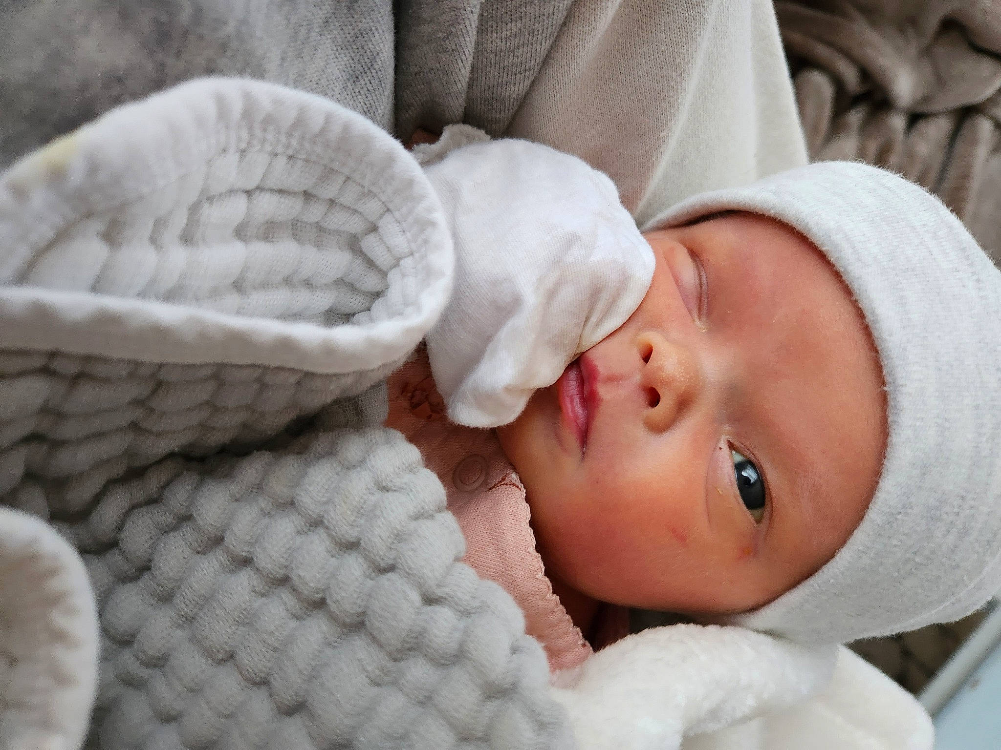 Rosalie is registered to the contest to win money with this photo: baby, baby_products, baby_sleeping, baby_toddler_clothing, beauty, cap, cheek, child, comfort, eyelash, fashion_accessory, headgear, headwear, knit_cap, linens, lip, pattern, person, skin, textile