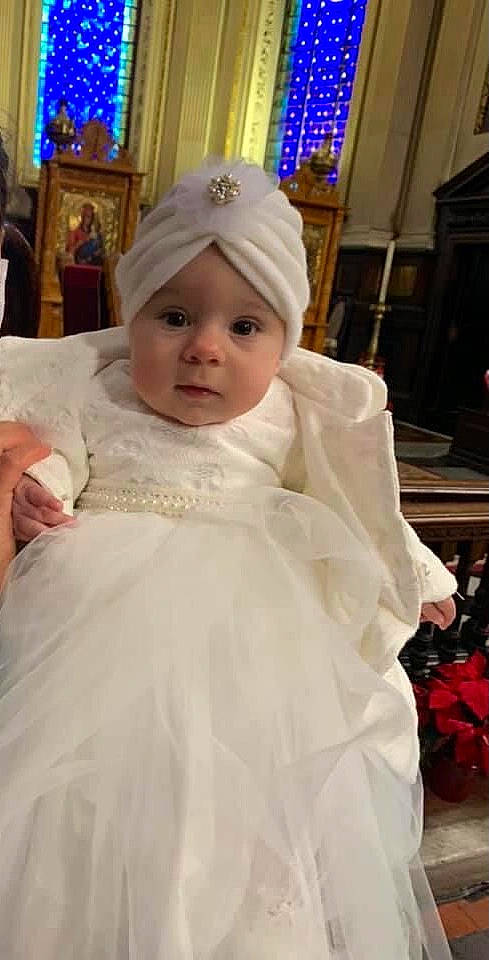 Celeste is registered to the contest to win money with this photo: baby, baby_toddler_clothing, blue, bridal_accessory, cap, dress, embellishment, event, formal_wear, gown, hair_accessory, happy, headgear, headpiece, headwear, person, pink, skin, smile, toddler