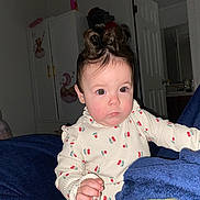 Zoe joined the competition — help win amazing prizes! baby, child, indoor, portrait, cute, curly_hair, blanket, clothing, face, expression, furniture, room, door, cabinet, earrings, pink, blue, white, red, person