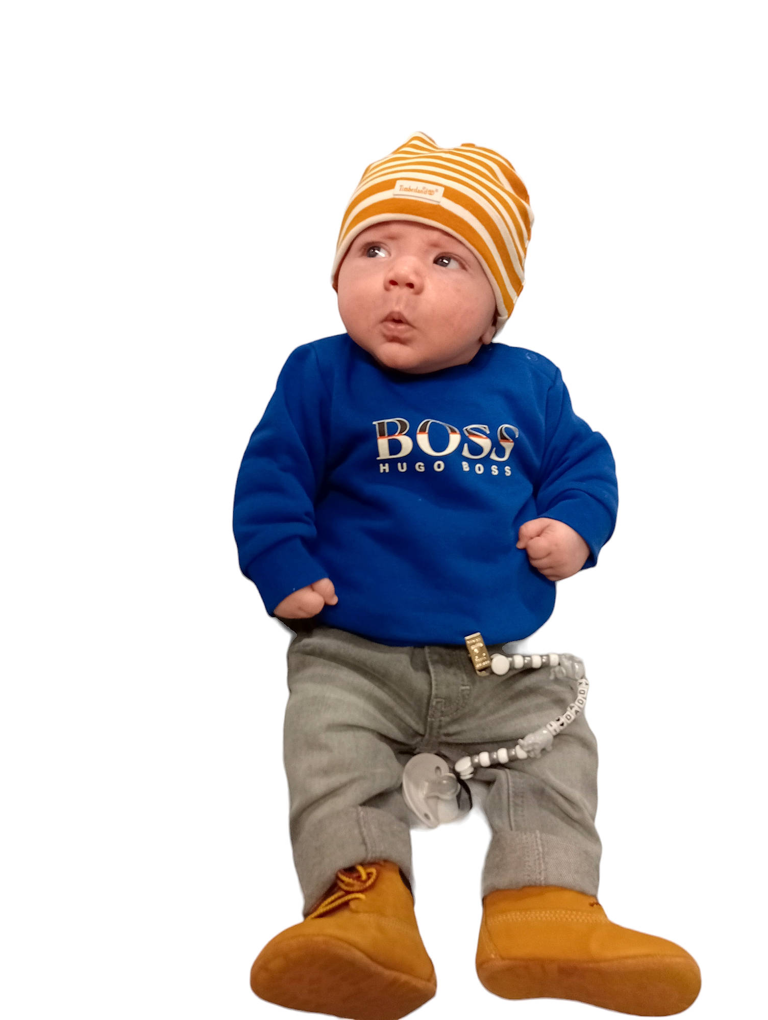 Thomas joined the competition — help win amazing prizes! baby, baby_toddler_clothing, beanie, cap, child, elbow, electric_blue, fashion_accessory, font, gesture, headwear, hood, khaki_pants, knee, knit_cap, logo, person, portrait_photography, sitting, sleeve