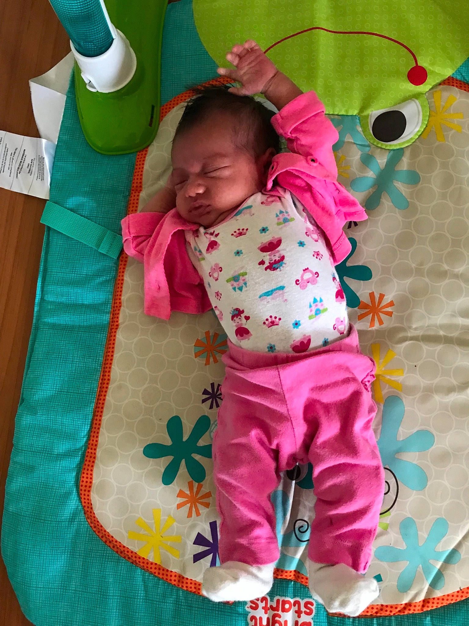 Margot is registered to the contest to win money with this photo: baby, baby_products, baby_toddler_clothing, child, nap_mat, person, pink, play, smile, textile, toddler