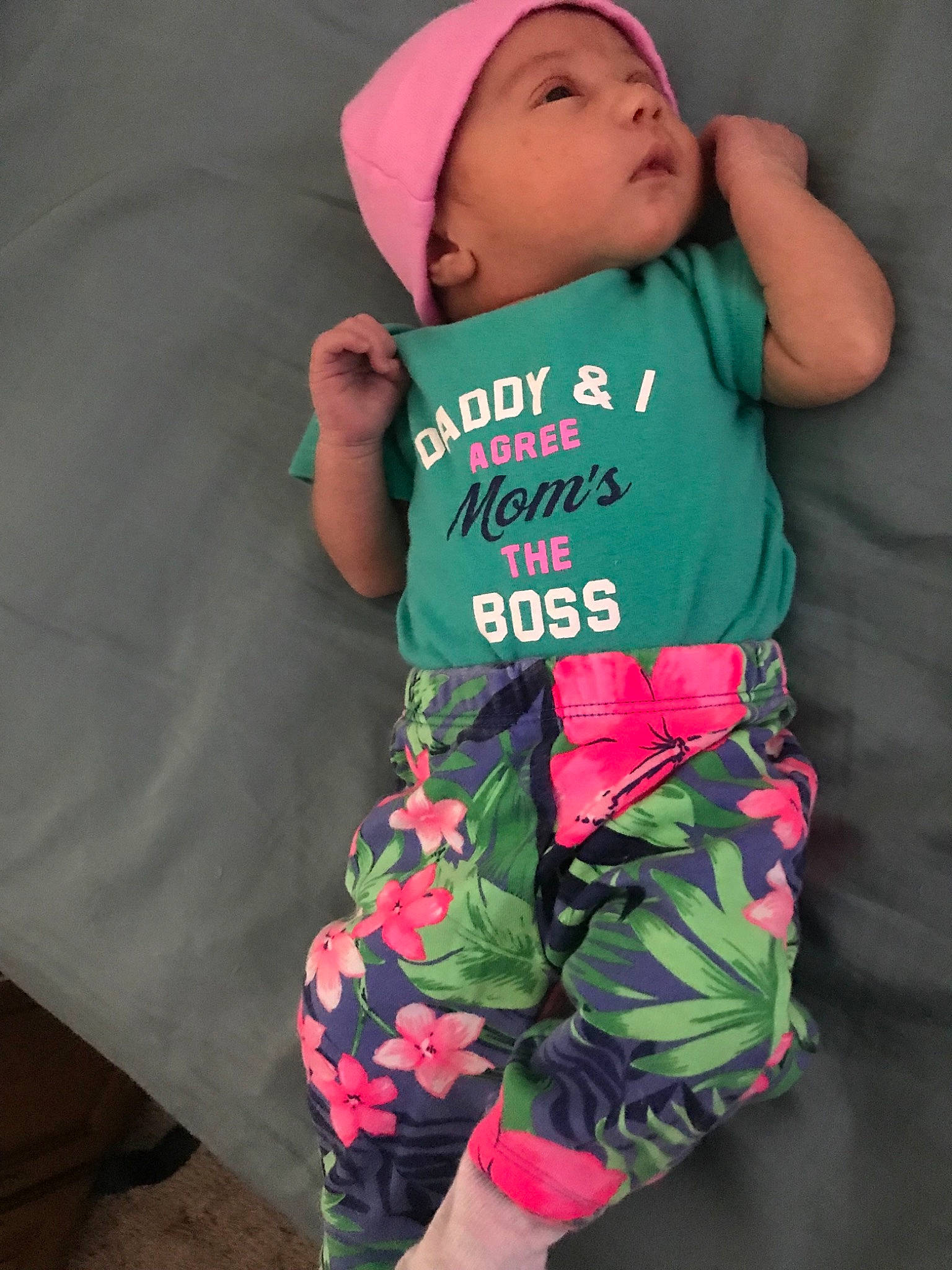 Margot is registered to the contest to win money with this photo: baby, baby_toddler_clothing, child, cool, green, headwear, person, pink, sleeve, smile, t_shirt, toddler