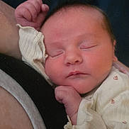 Joshlyn joined the competition — help win amazing prizes! newborn, baby, sleeping_baby, infant, face, hand, arm, onesie, clothing, portrait, close_up, resting, peaceful, parent_arm, skin, indoors, cuddling, blanket, head, cheek