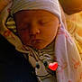 Joshlyn joined the competition — help win amazing prizes! newborn, baby, sleeping, beanie, hat, swaddle, blanket, hospital_blanket, face, closed_eyes, infant, cozy, warm_light, cuddle, parent_arm, emoji_overlay, heart_emoji, portrait, soft_lighting, hospital
