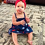 Kehlani joined the competition — help win amazing prizes! baby, child, girl, headband, red_bow, dress, navy_blue, patterned_dress, sitting, carpet, indoor, curious, hands, barefoot, cute, portrait, infant, floor, home, young_child