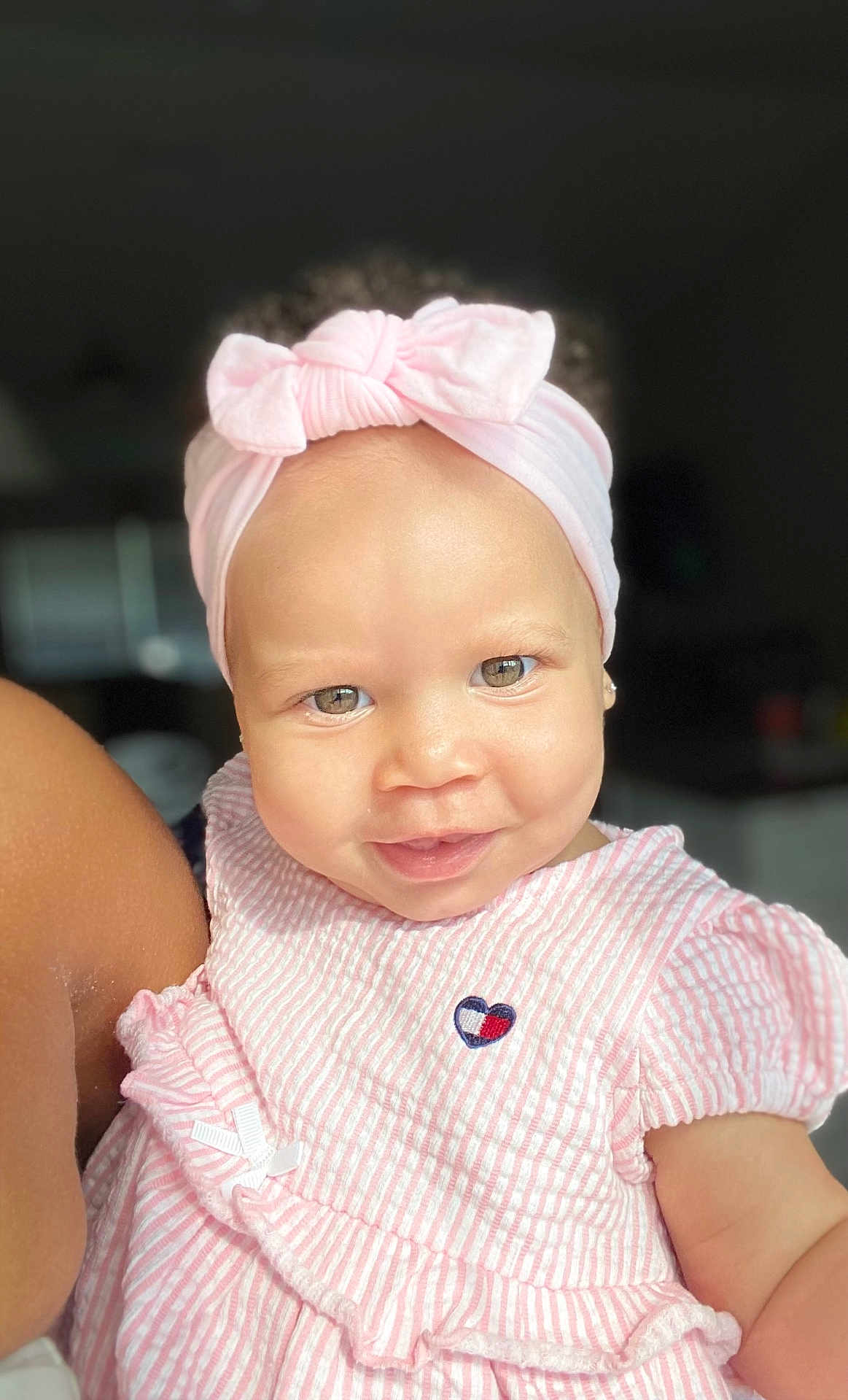 Kehlani joined the competition — help win amazing prizes! baby, child, smiling, headband, pink_clothing, striped_dress, heart_emblem, portrait, face, cute, infant, person, indoors, soft_lighting, closeup, happy, young_child, skin, apparel, ribbon