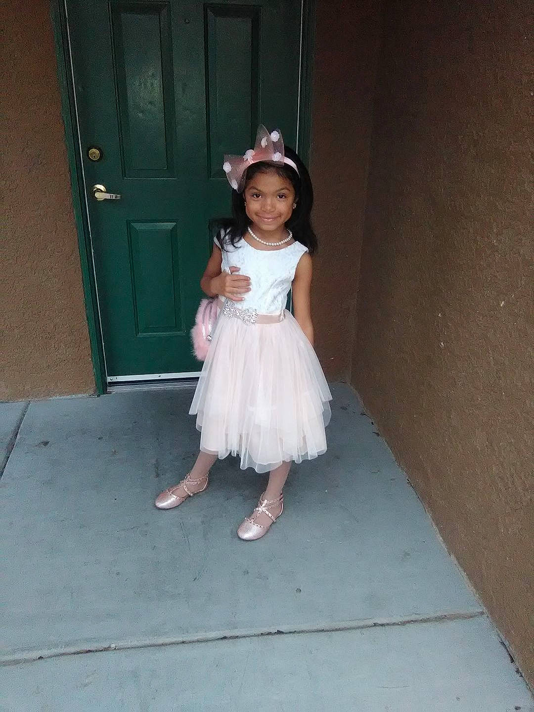 Katelyn Torres joined the competition — help win amazing prizes! bridal_clothing, child, costume, dress, flooring, flower_girl, fun, girl, gown, hair_accessory, joy, person, smile, standing, textile, toddler, wedding_dress