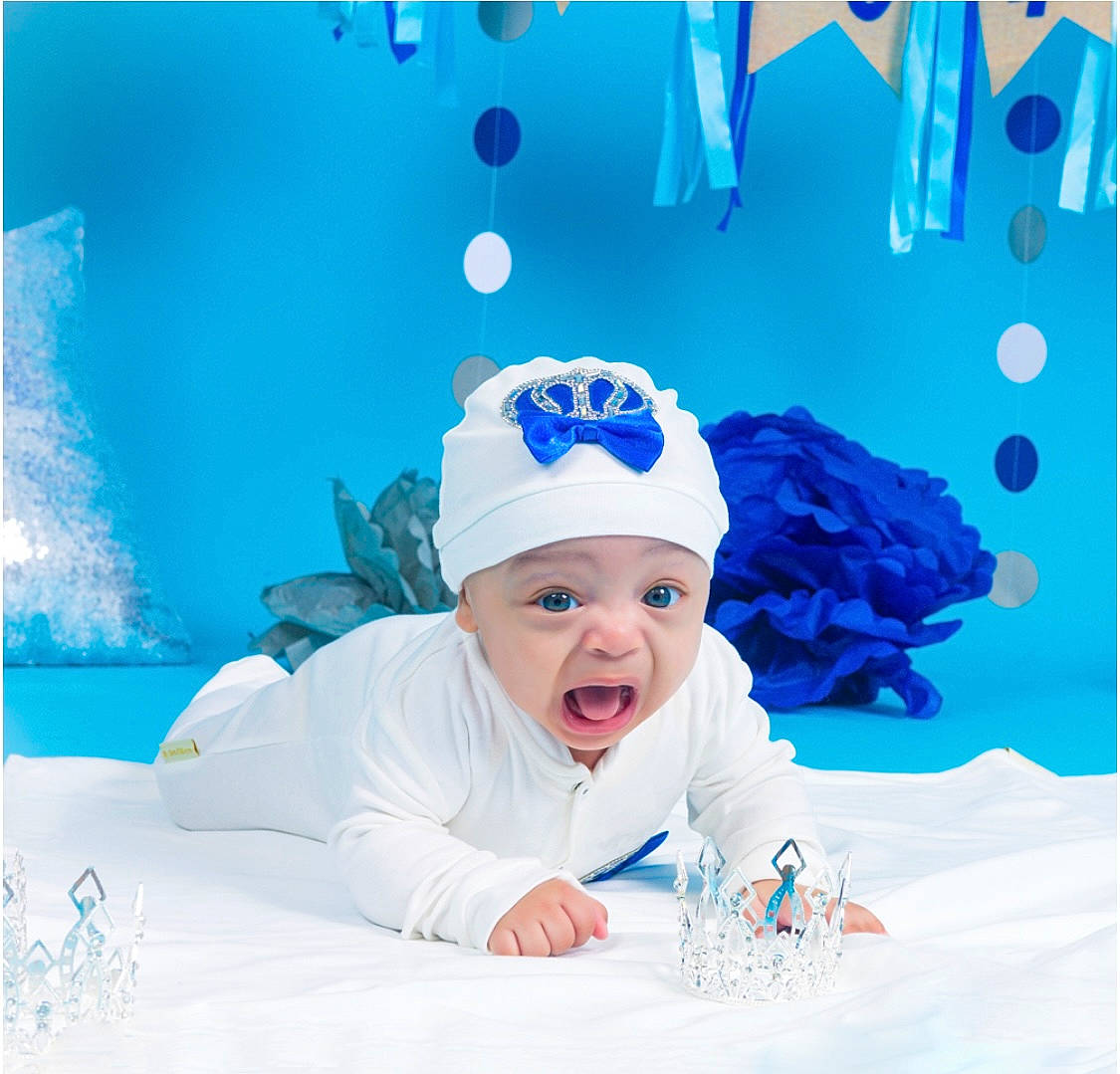 Donovan is registered to the contest to win money with this photo: aqua, art, azure, baby, baby_toddler_clothing, cap, child, cloud, electric_blue, font, freezing, fun, happy, headwear, leisure, paint, person, rectangle, smile, stock_photography