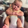 Valentino joined the competition — help win amazing prizes! baby, infant, child, face, feet, baby_seat, clothing, expression, indoor, person, cute, skin, arm, hand, head_tilt, foot, seat, furniture, young_child, portrait