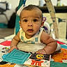 Valentino joined the competition — help win amazing prizes! baby, child, playmat, soft_toy, colorful, indoor, cute, curious, infant, person, portrait, hand, face, expression, book, clothing, toddler, bright, background_blur, play