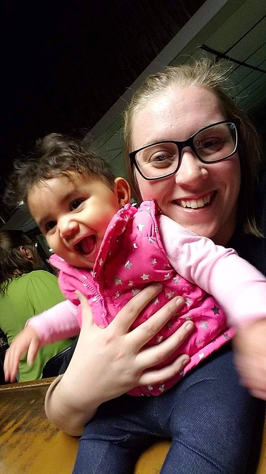 Kasiah is registered to the contest to win money with this photo: child, daughter, finger, flesh, fun, gesture, glasses, hand, joy, mother, person, pink, smile, thumb, toddler